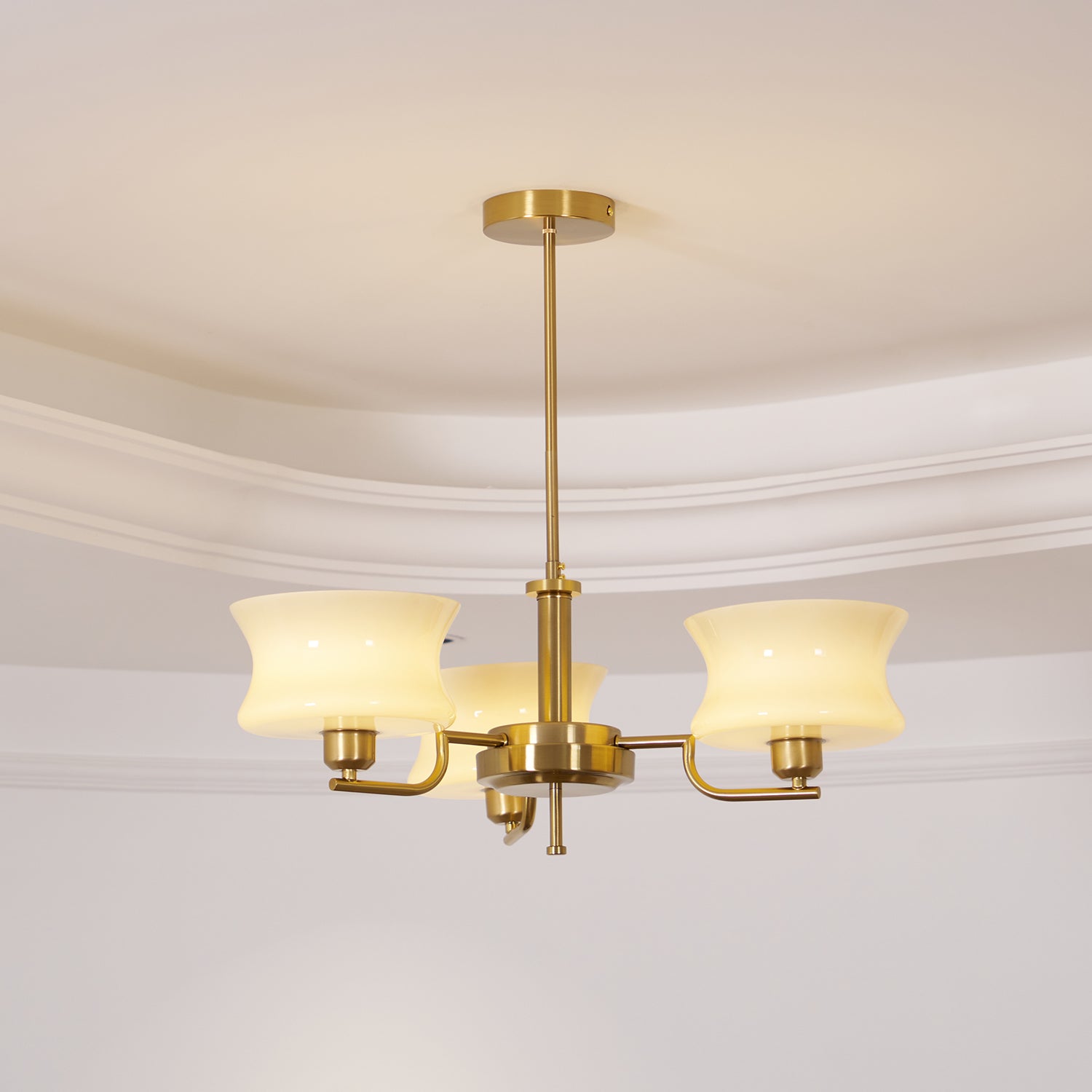 Glass globe chandelier with chrome arms and rounded shades