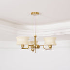 Three-head glass globe chandelier with beige shades and gold frame