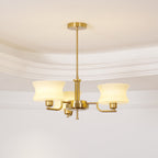Globe chandelier detail with warm filament bulbs in glass shades