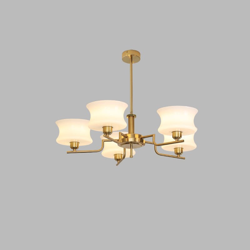 Round glass globe shades on a gold vintage chandelier frame
