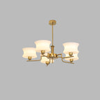Round glass globe shades on a gold vintage chandelier frame