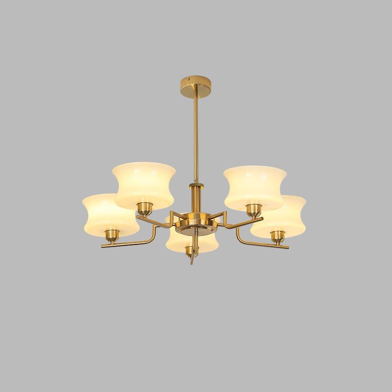 Globe chandelier in chrome finish above a living room sofa