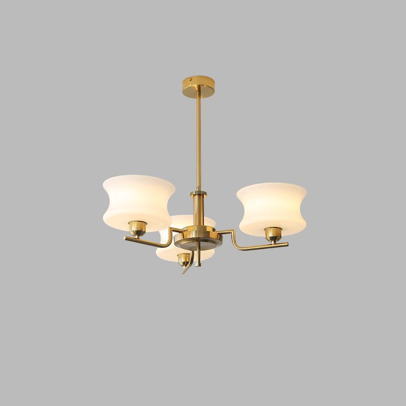 Five-head globe chandelier with rounded glass shades and gold finish