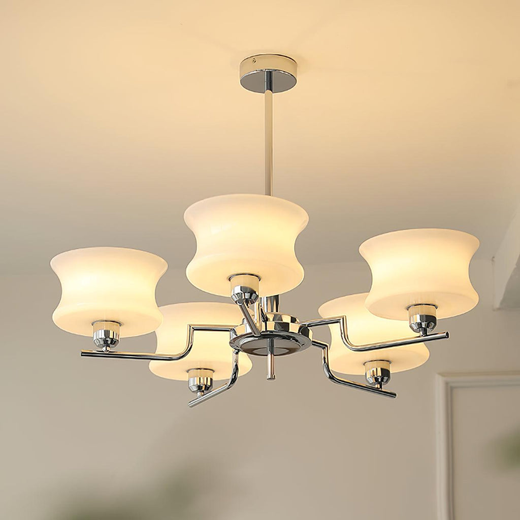Five-head globe chandelier casting warm light over a table