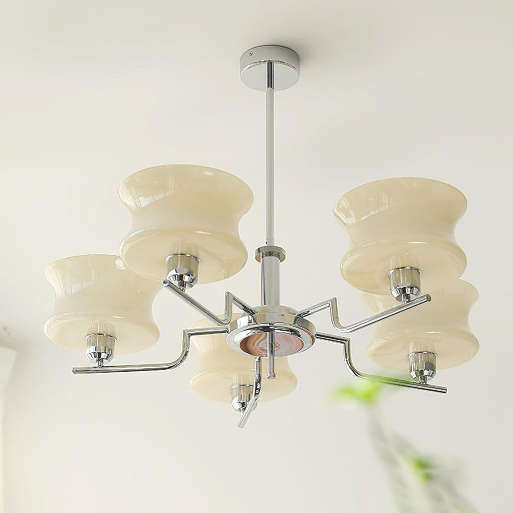Glass globe chandelier with beige shades glowing in soft light