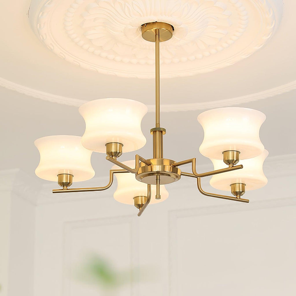 Vintage chandelier with white glass globes and gold metal body