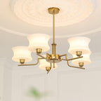 Vintage chandelier with white glass globes and gold metal body
