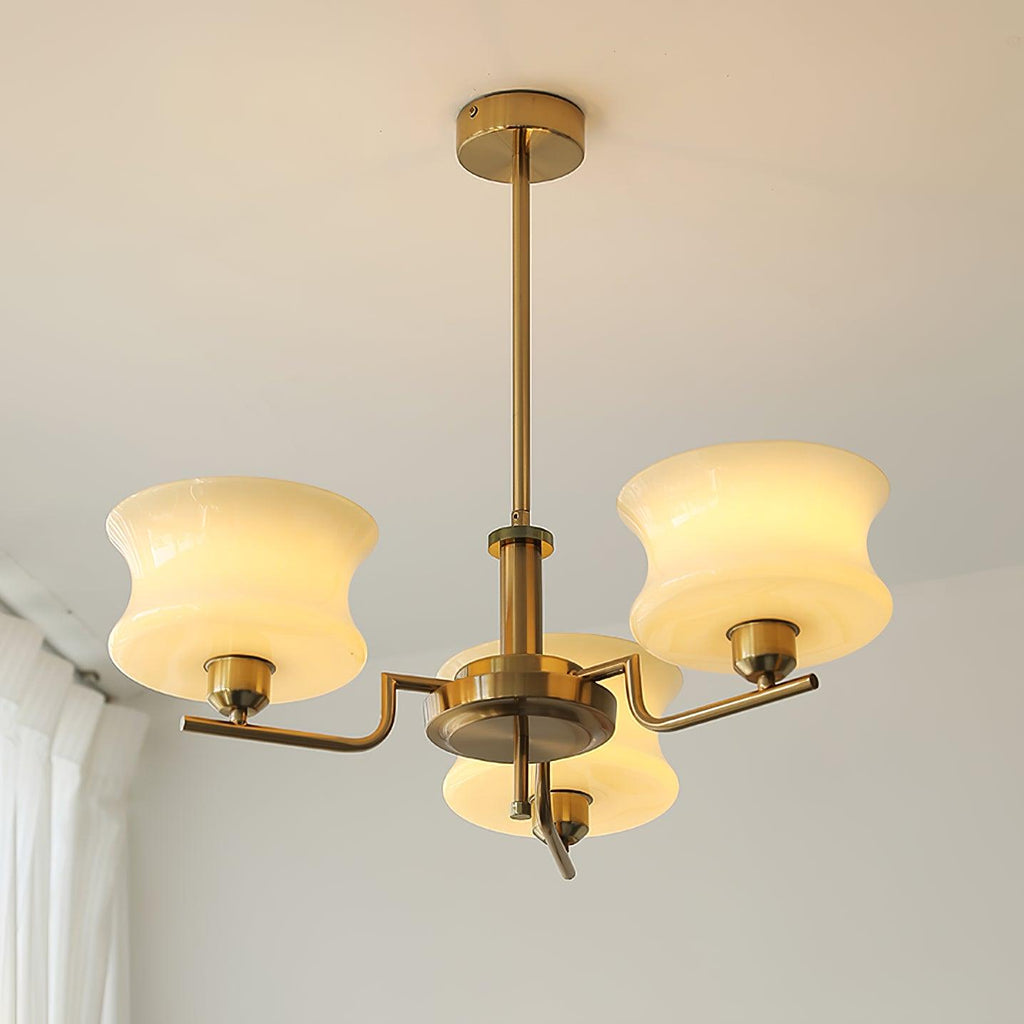 Five-head glass globe chandelier suspended above a dining table