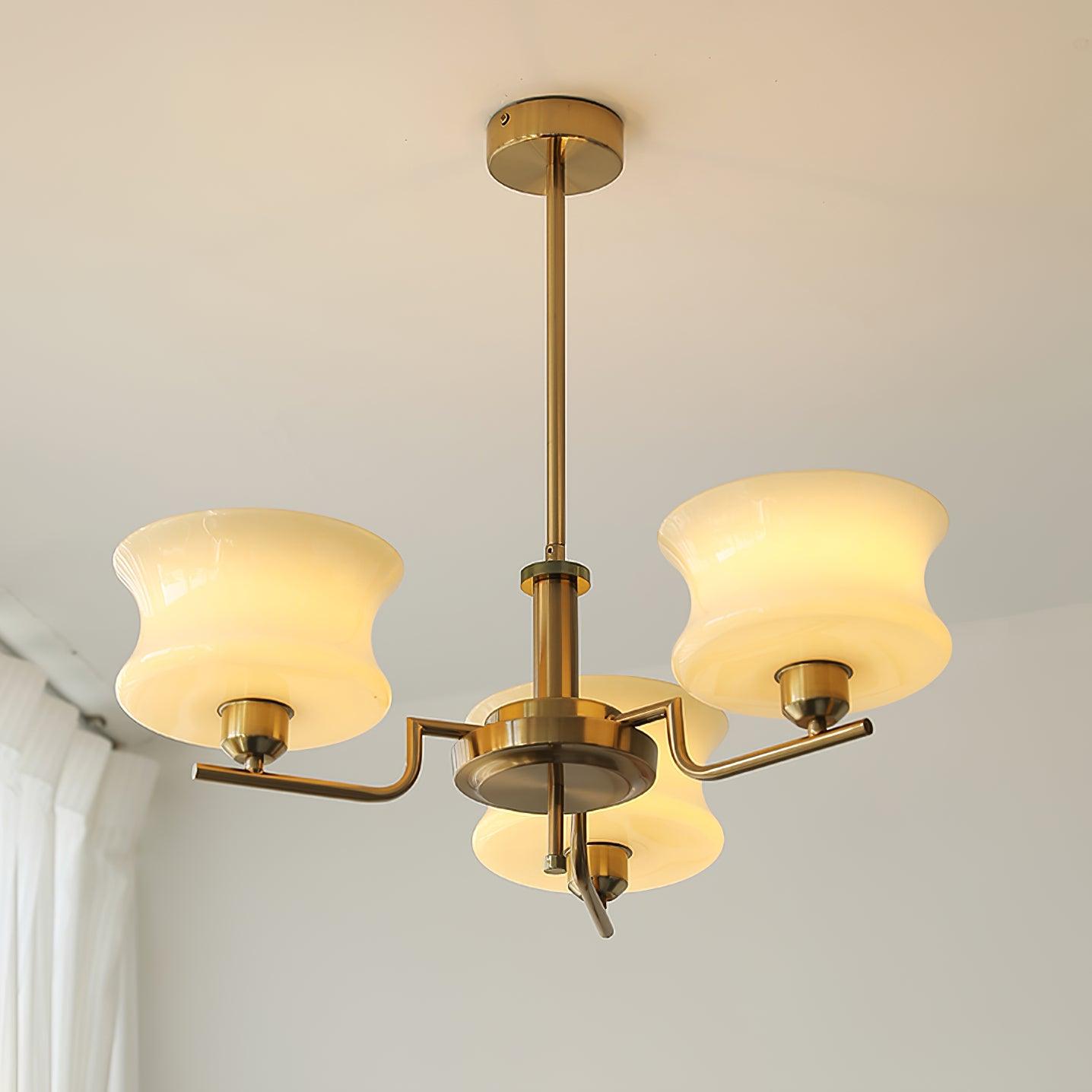 Five-head glass globe chandelier suspended above a dining table