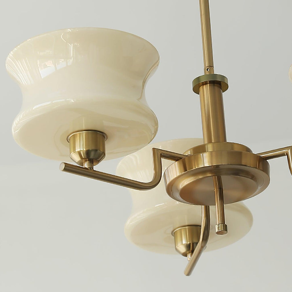 Five-head glass globe chandelier with rounded shades and gold finish