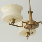 Five-head glass globe chandelier with rounded shades and gold finish