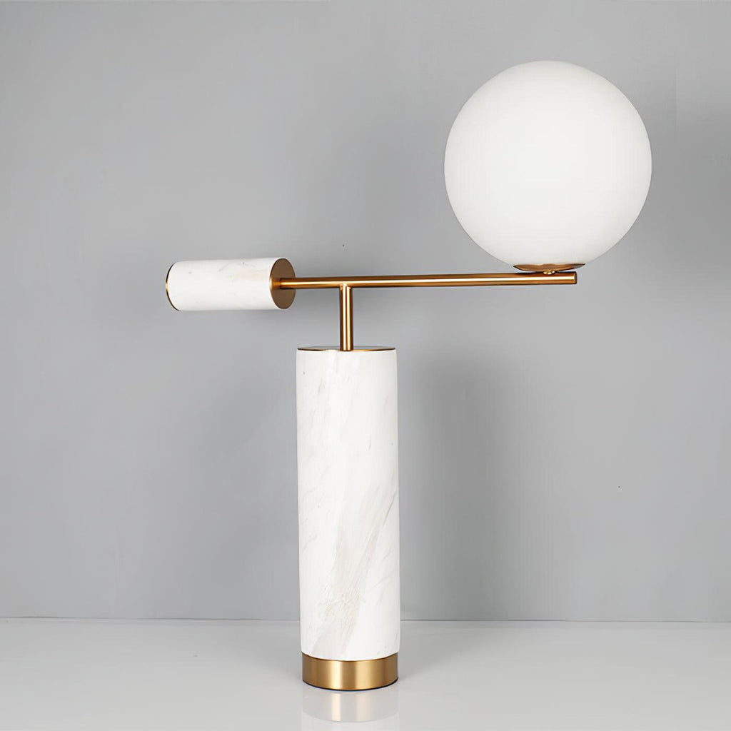 This Clérachic desk lamp in the white marble finish stands against a plain grey backdrop, its glass globe unlit.