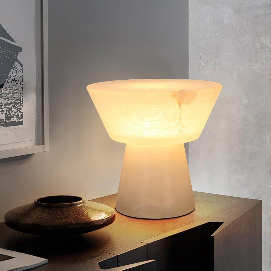 A tighter crop on the Clérachic alabaster lamp, set on a sideboard beside the same bronze bowl as before.