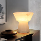 A tighter crop on the Clérachic alabaster lamp, set on a sideboard beside the same bronze bowl as before.