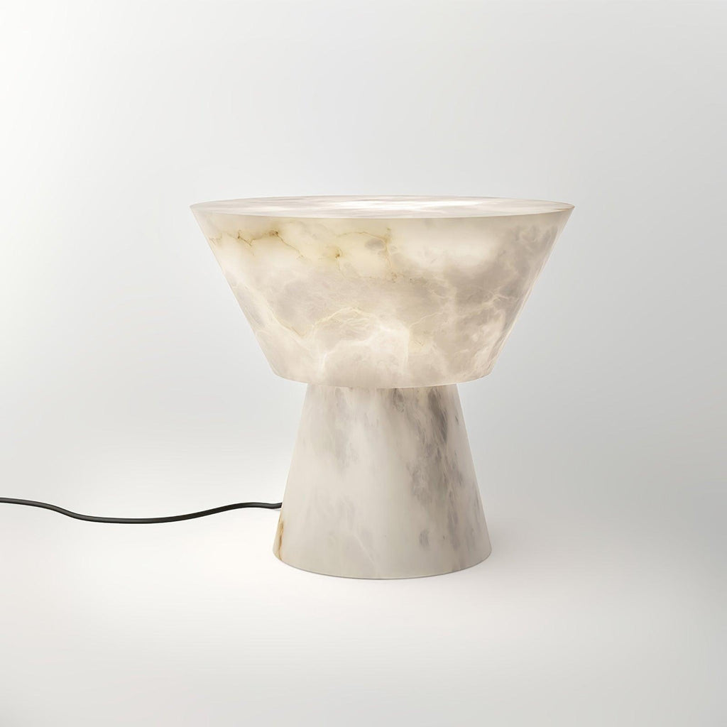 Lit noticeably brighter here, the Clérachic alabaster lamp sits on white with no cord in view.