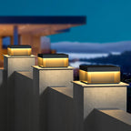 Sandblasted black outdoor post lamp glowing at night