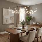 Branch chandelier glowing like fireflies over a dining room