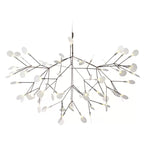 Firefly LED chandelier glowing softly above a dining setting
