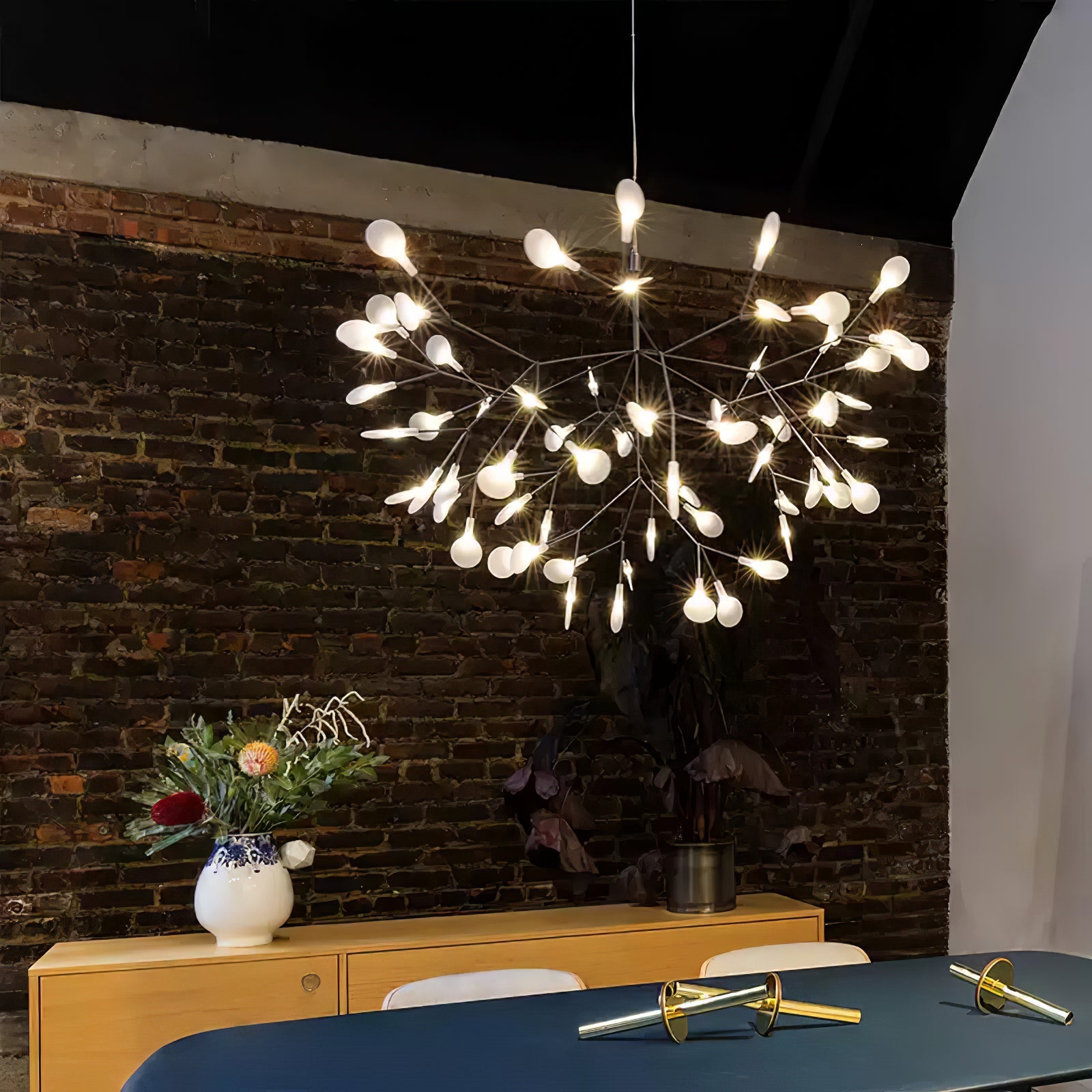 Black firefly chandelier with glowing acrylic tips on branches