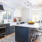 Branch chandelier with scattered warm lights in black finish