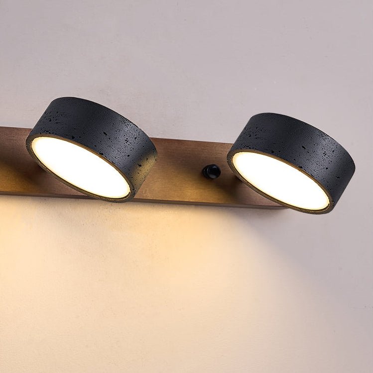 Travertine wall light showing matte black stone shades