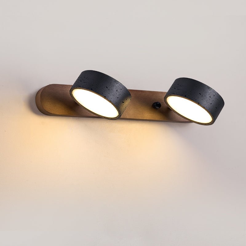 Black travertine wall sconce with walnut frame and rotating heads
