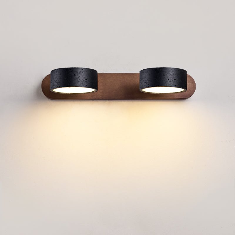Black travertine wall sconce with three rotating light heads