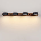 Black stone wall sconce mounted on a neutral wall