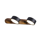 Black travertine wall sconce with walnut frame and warm light