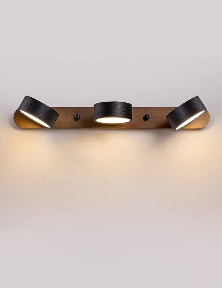 Black stone and walnut wall sconce close-up detail
