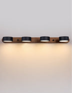 Travertine wall sconce mounted above a bedside table