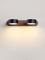 Walnut and travertine wall light angled to wash the wall