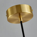 Close-up of the Clérachic pendant's brass ceiling canopy, showing the round backplate, mounting screws and cord exit.