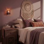 Brass wall sconce with wine red glass accent against a pale wall