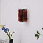Brass wall sconce with clear glass plates and gold finish frame
