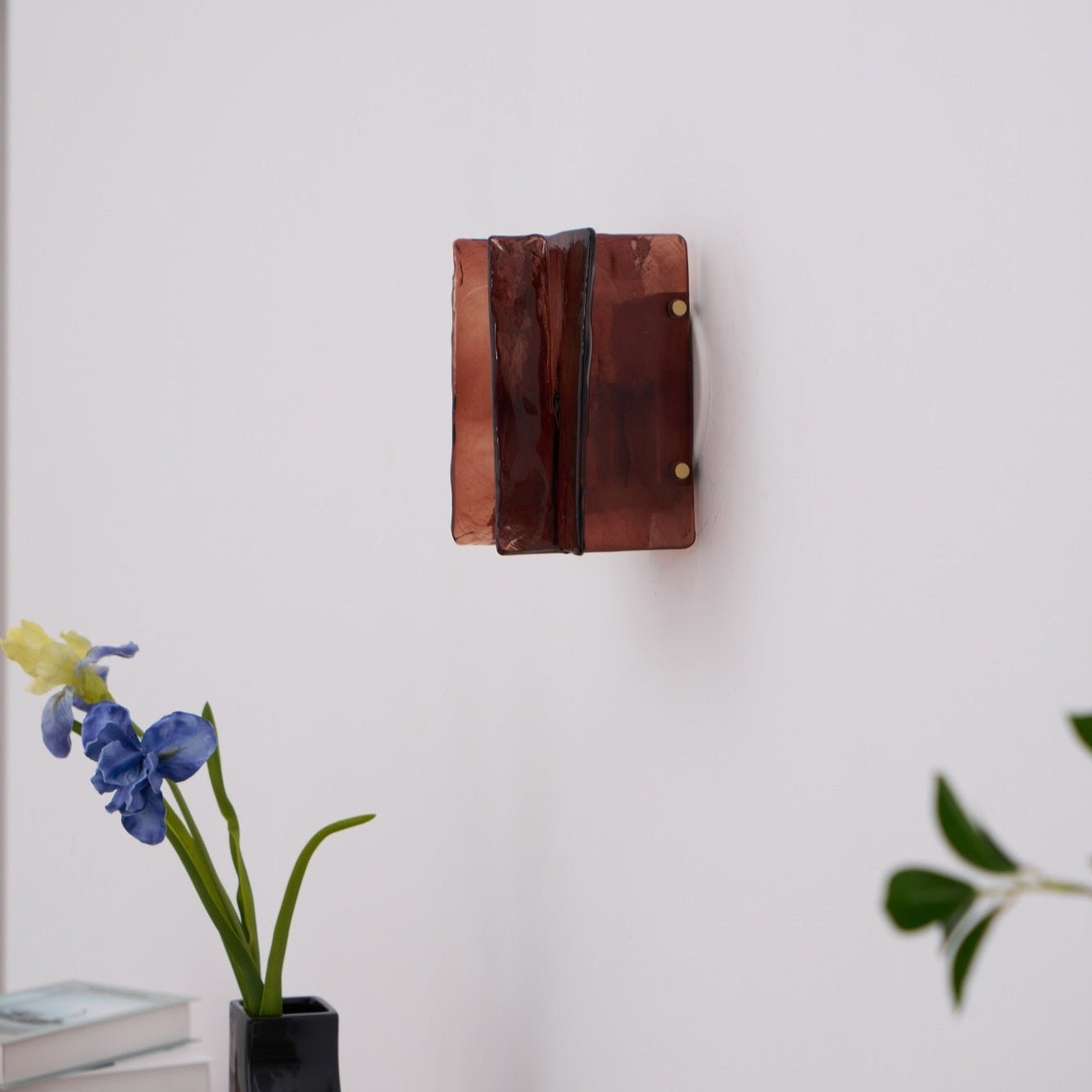 Brass wall sconce with clear glass plates and gold finish frame