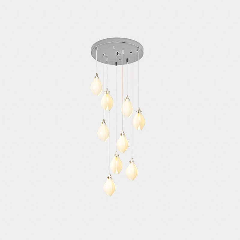 White ceramic bloom pendant lights suspended at varied heights
