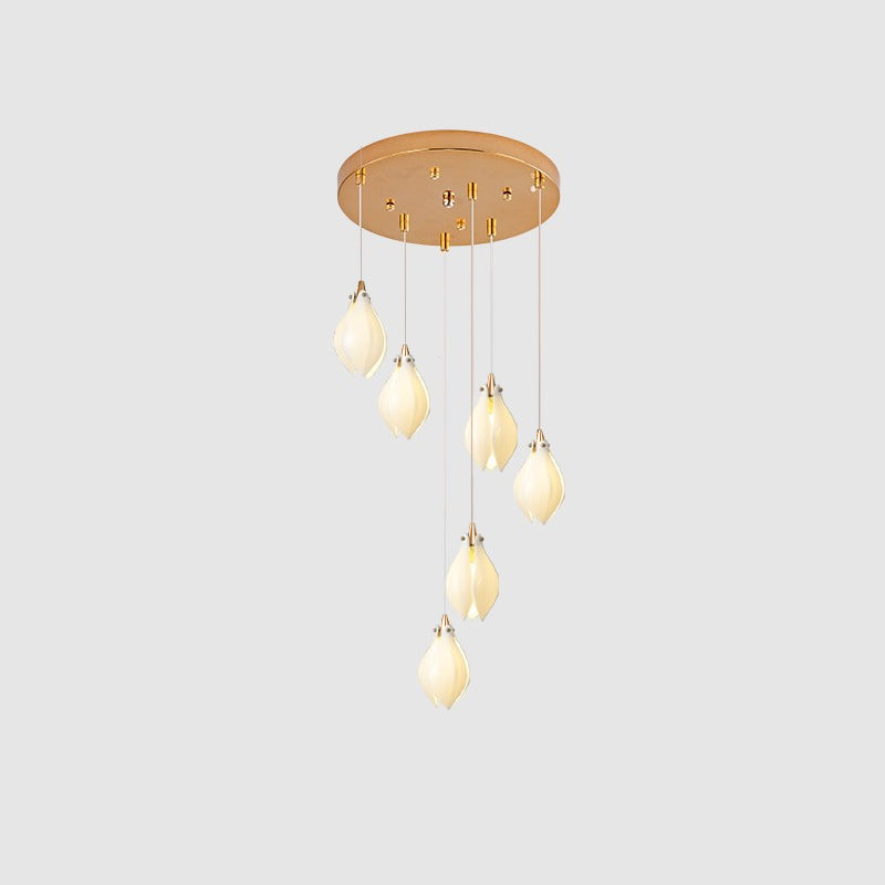 Large ceramic flower pendant light installation across a tall space