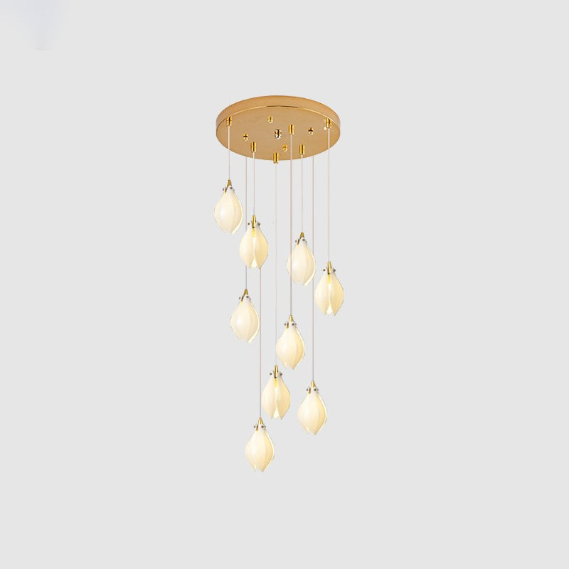 Ceramic flower pendant light arrangement glowing over an interior