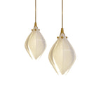 Ceramic flower pendant light with multiple lit blooms in a room