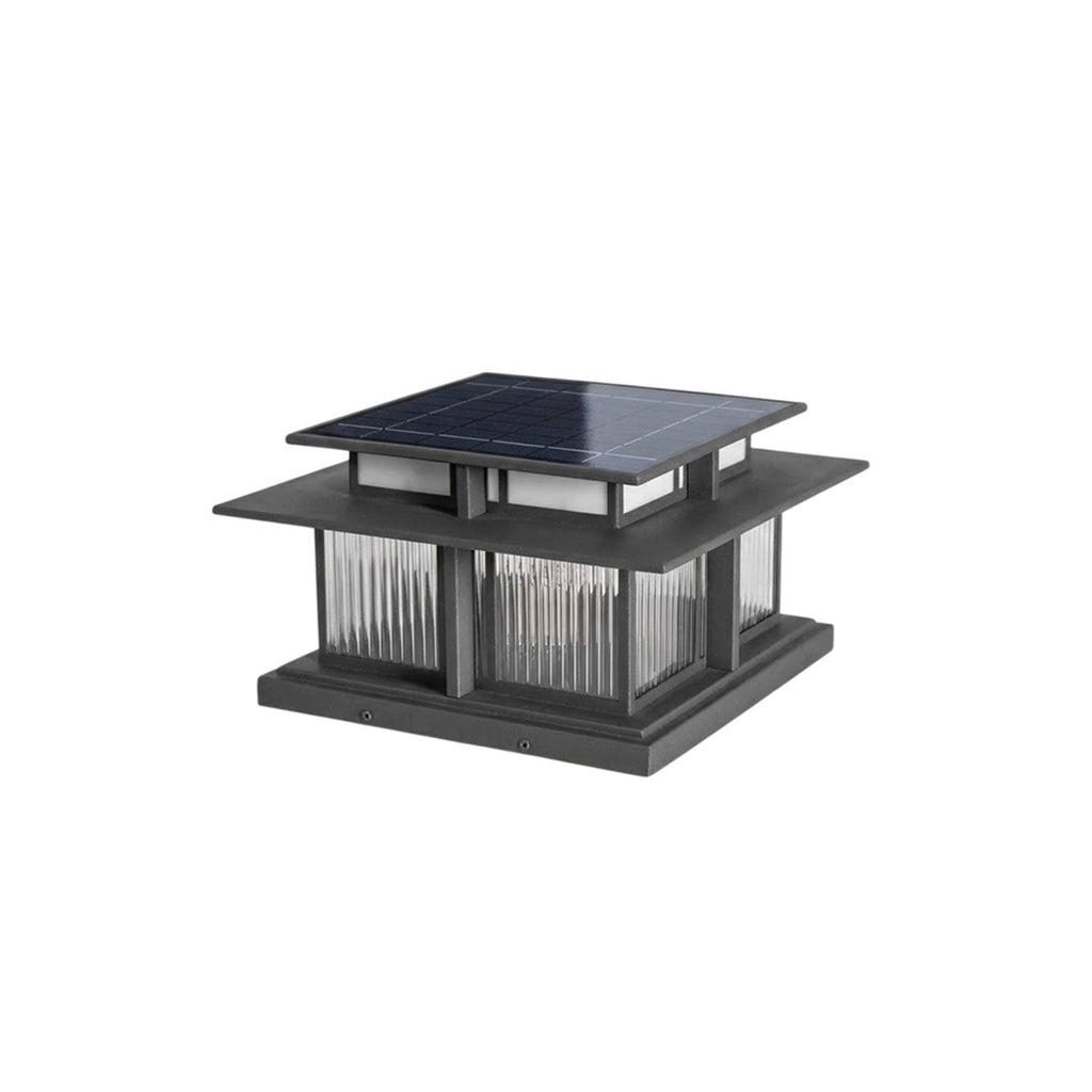 A closer crop of this unlit Clérachic pillar light, the solar panel and fluted glass panels visible from an angle.