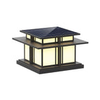 Another lit view of this Clérachic pillar light, its solar panel and glowing frosted glass shown against white.
