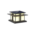 A further angle of this lit Clérachic pillar light, warm light through frosted panels beneath the solar roof.