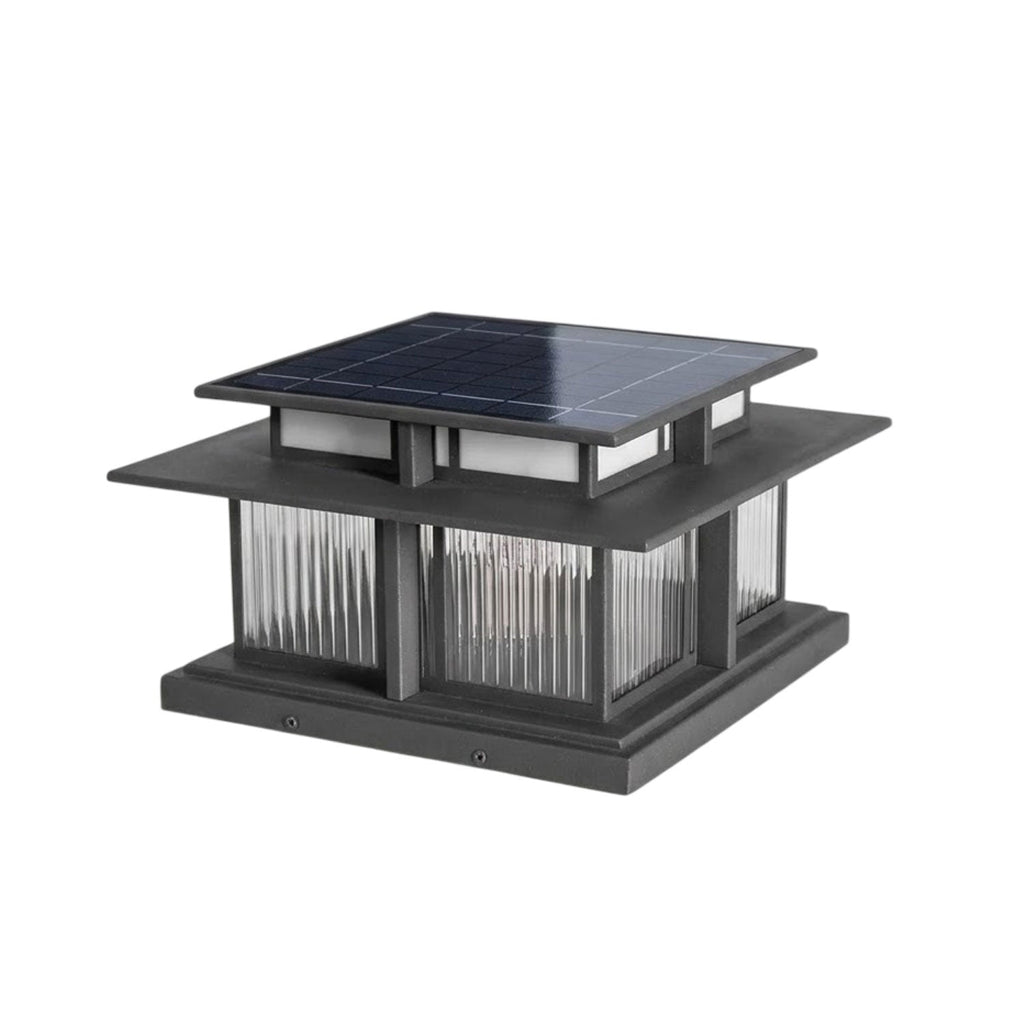 This unlit Clérachic pillar light shows a solar panel set into its roof above fluted glass panels, on a white backdrop.