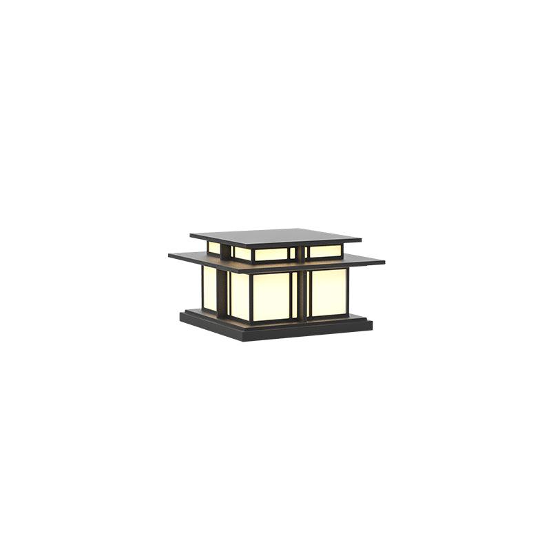 A front view of this unlit Clérachic pillar light against a white backdrop, its frosted glass panels pale and even.