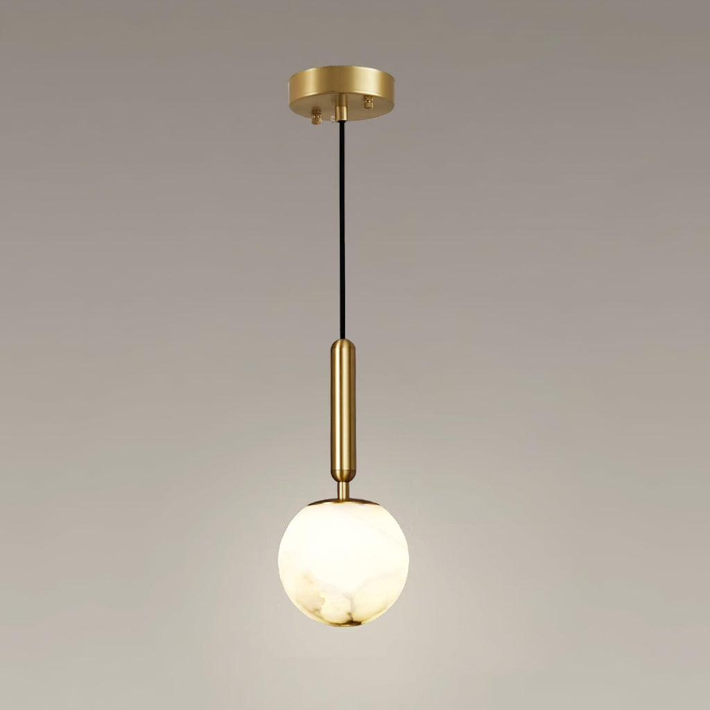 The full pendant with its round brass ceiling plate, black cord and lit alabaster globe.