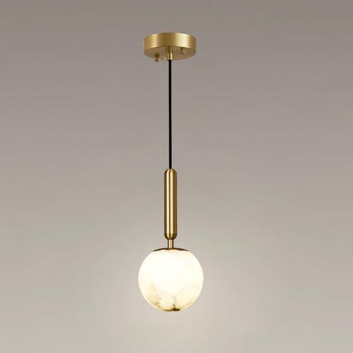 The full pendant with its round brass ceiling plate, black cord and lit alabaster globe.