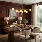 A brushed-brass Clérachic chandelier glows in a wood-panelled dining room with boucle-upholstered chairs.