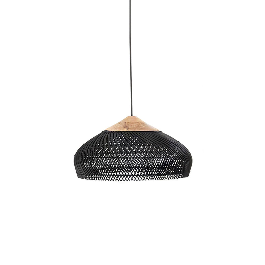 Black woven rattan pendant light glowing softly above a sofa
