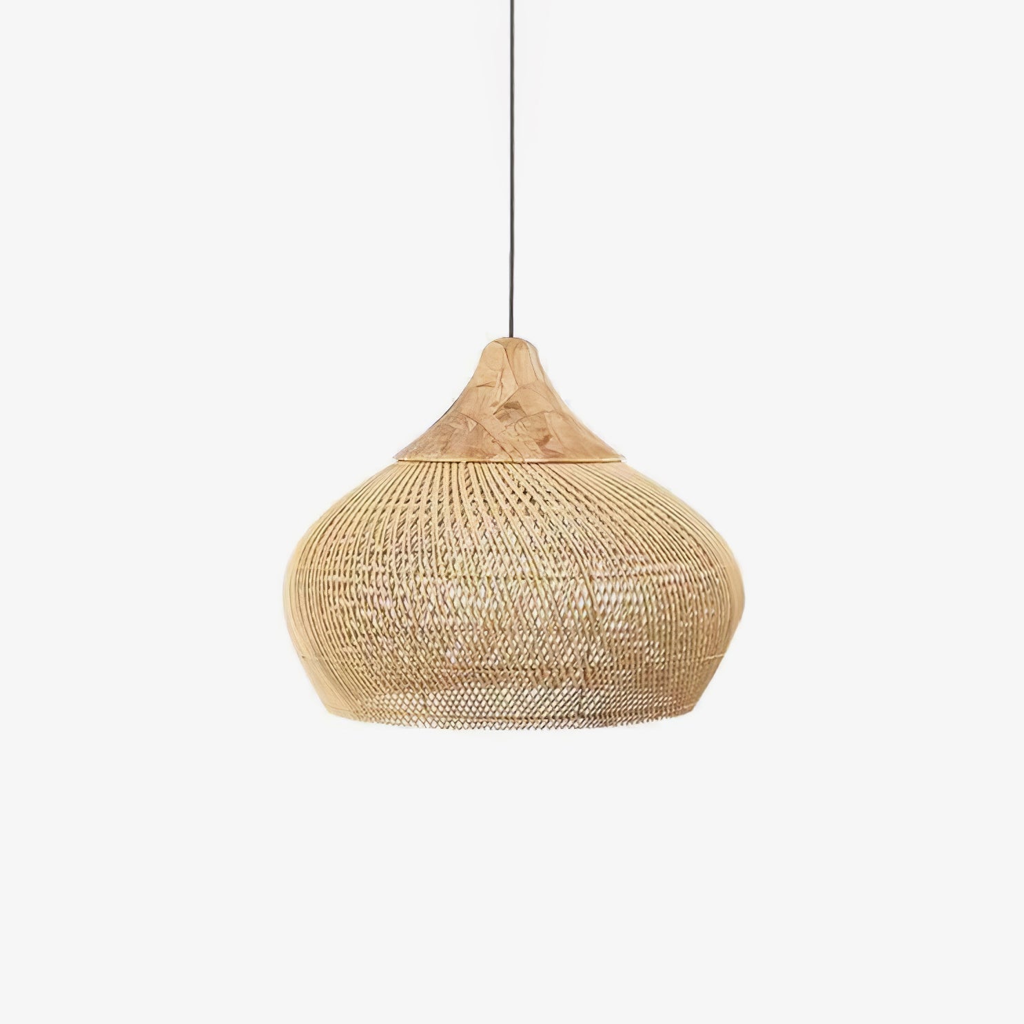 Handwoven natural rattan pendant light against a light wall